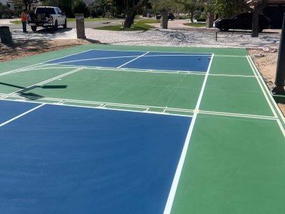 Vivid blue and green tennis court paint with high durability.