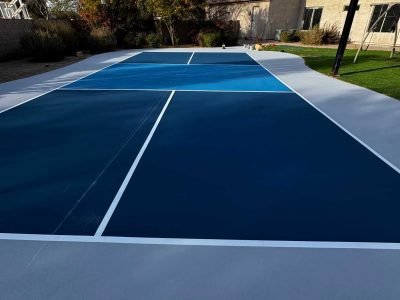 High-quality basketball court resurfacing with weather-resistant paint and smooth finish for optimal play and durability.